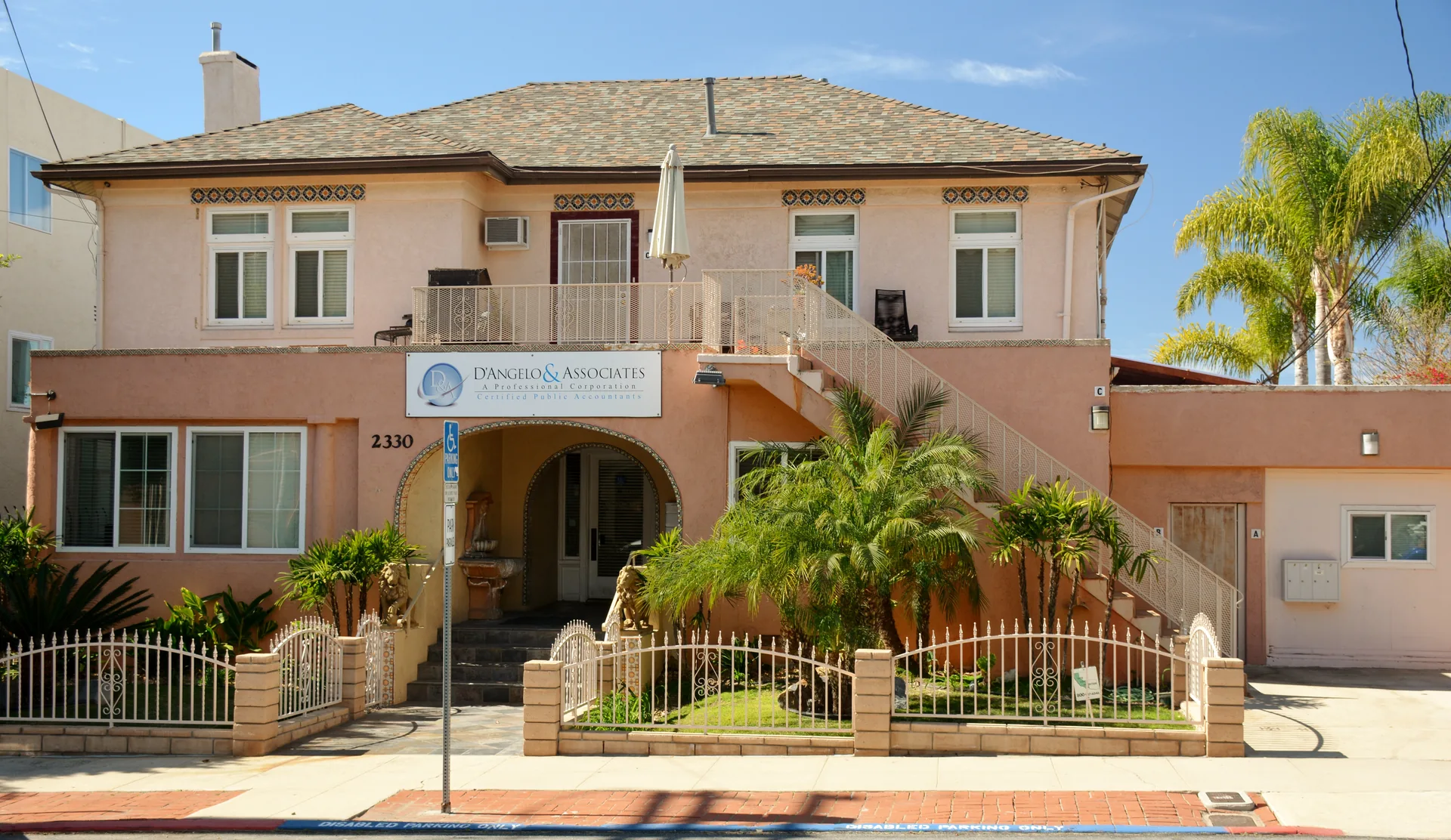 A stucco building with an arched entrance in Bankers Hill, San Diego.